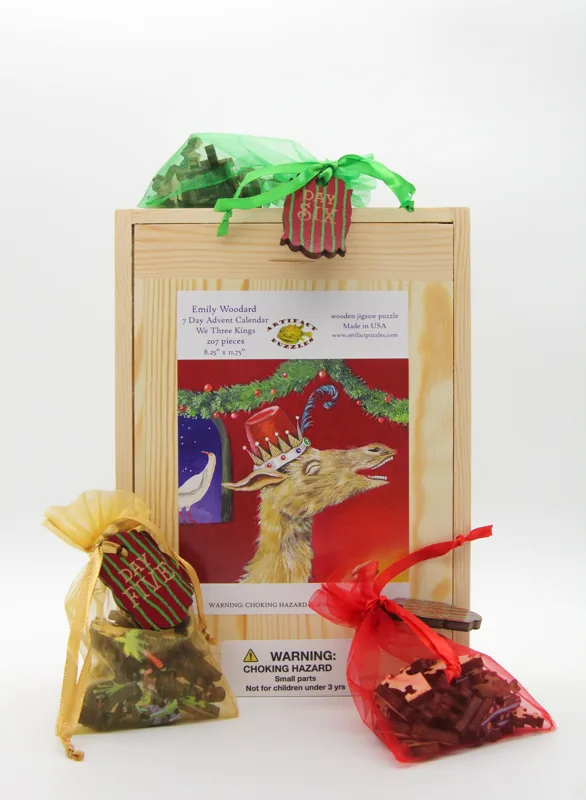 Artifact Puzzles - E.C. Woodard We Three Kings Seven Day Advent Calendar Wooden Jigsaw Puzzle — numbered daily bags / product packaging