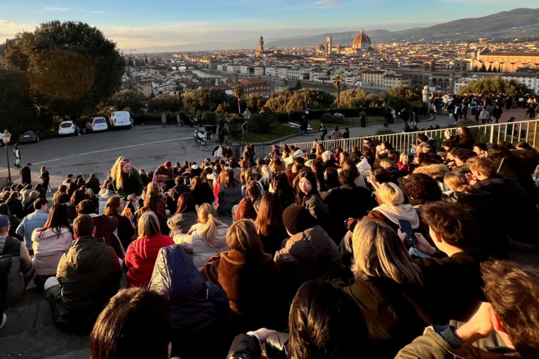 Sunset in Florence, with visitors overlooking the city